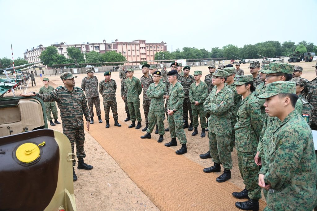 Singapore Soldiers Looking at Indian Defence Equipment
