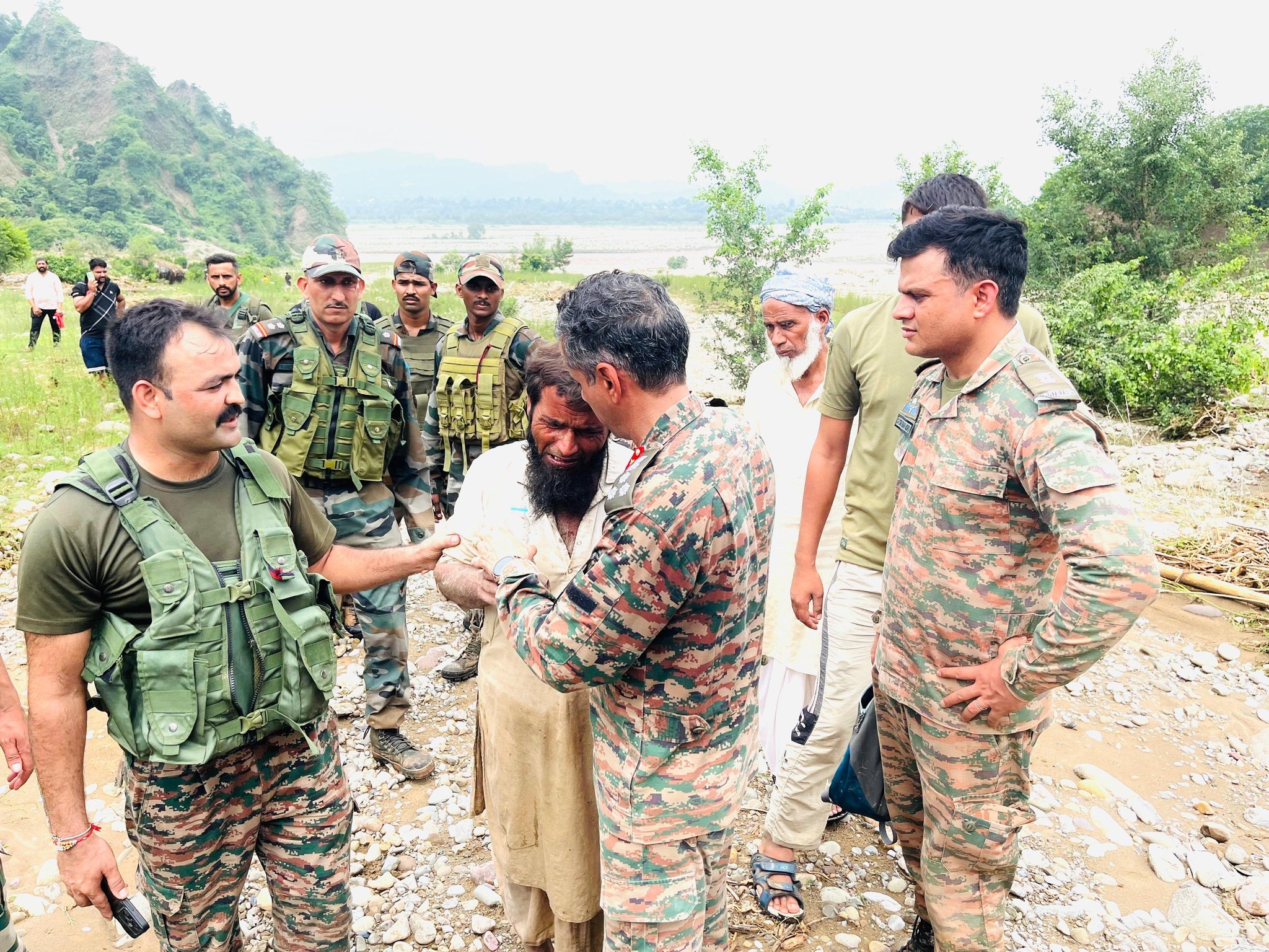 Army Officer Consoling Local