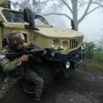 Soldier Along Army Hummer