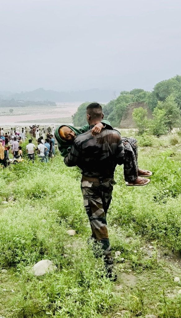 Soldier Saving an Old Lady