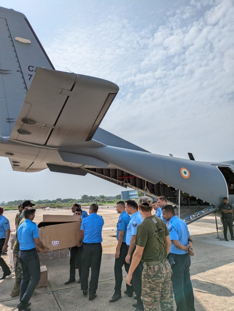 Soldiers Putting Items in C295