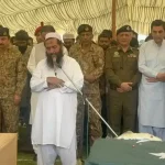 Terrorist with Pakistani Soldiers