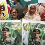Women Holding Asim Munir Poster