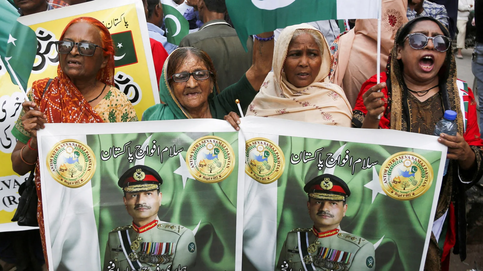 Women Holding Asim Munir Poster