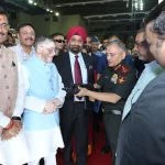 Gen Anil Chauhan Showcasing a Gun