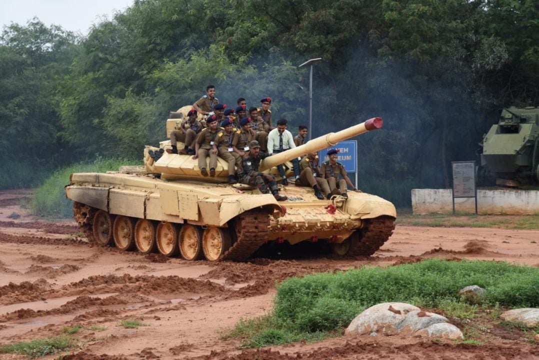 Sainik School Cadets Sitting on a Tank