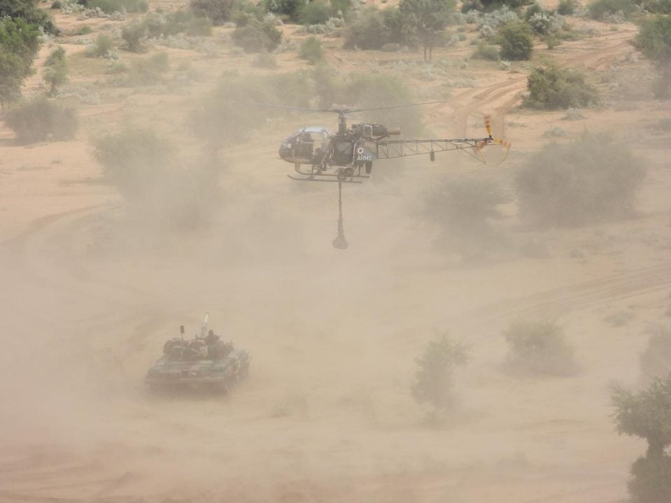 Helicopters and Tanks in Exercise