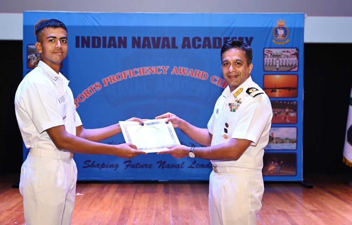 Officer Awarding Male Cadet at INA