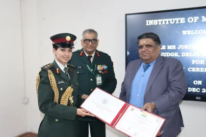 Female Officer Getting Certificate