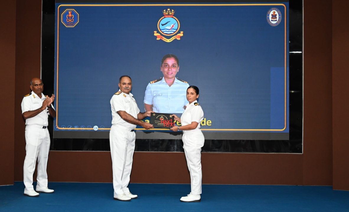 Rear Admiral Anshuman Chauhan Awarding to Female Officer