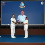 Rear Admiral Anshuman Chauhan Giving Award to Female Officer