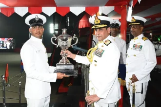 Vice Admiral Sameer Saxena Giving Award to Agniveer 1