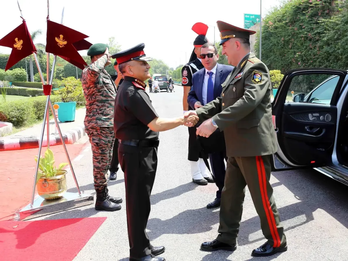 CDS Gen Chauhan Shaking Hands