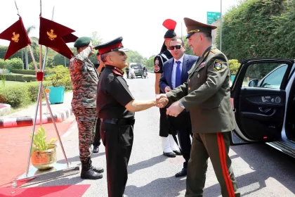 CDS Gen Chauhan Shaking Hands
