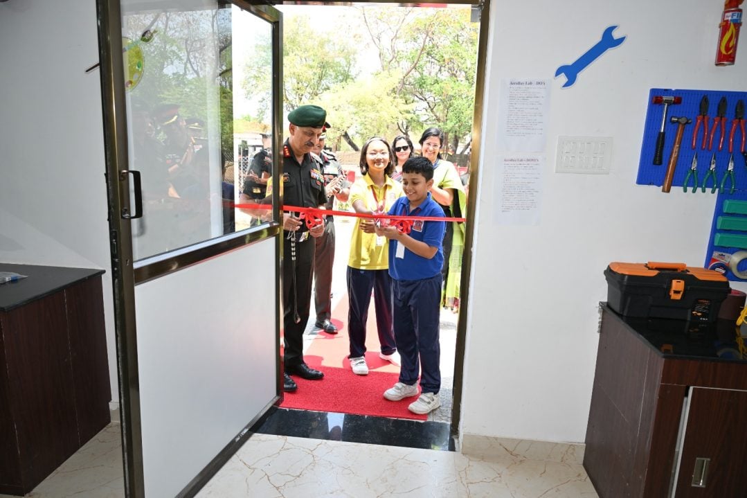 Child Cutting Ribbon
