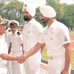 Vice Adm C R Praveen Nair Shaking Hands