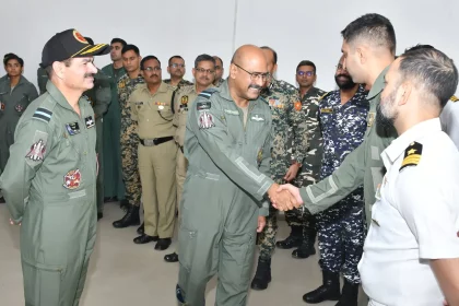 Air Marshal George Thomas Shaking Hands