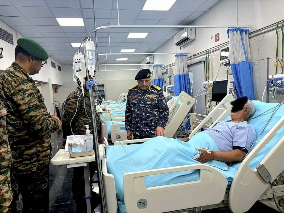 Surg VAdm Vivek Hande Interacting with Patient