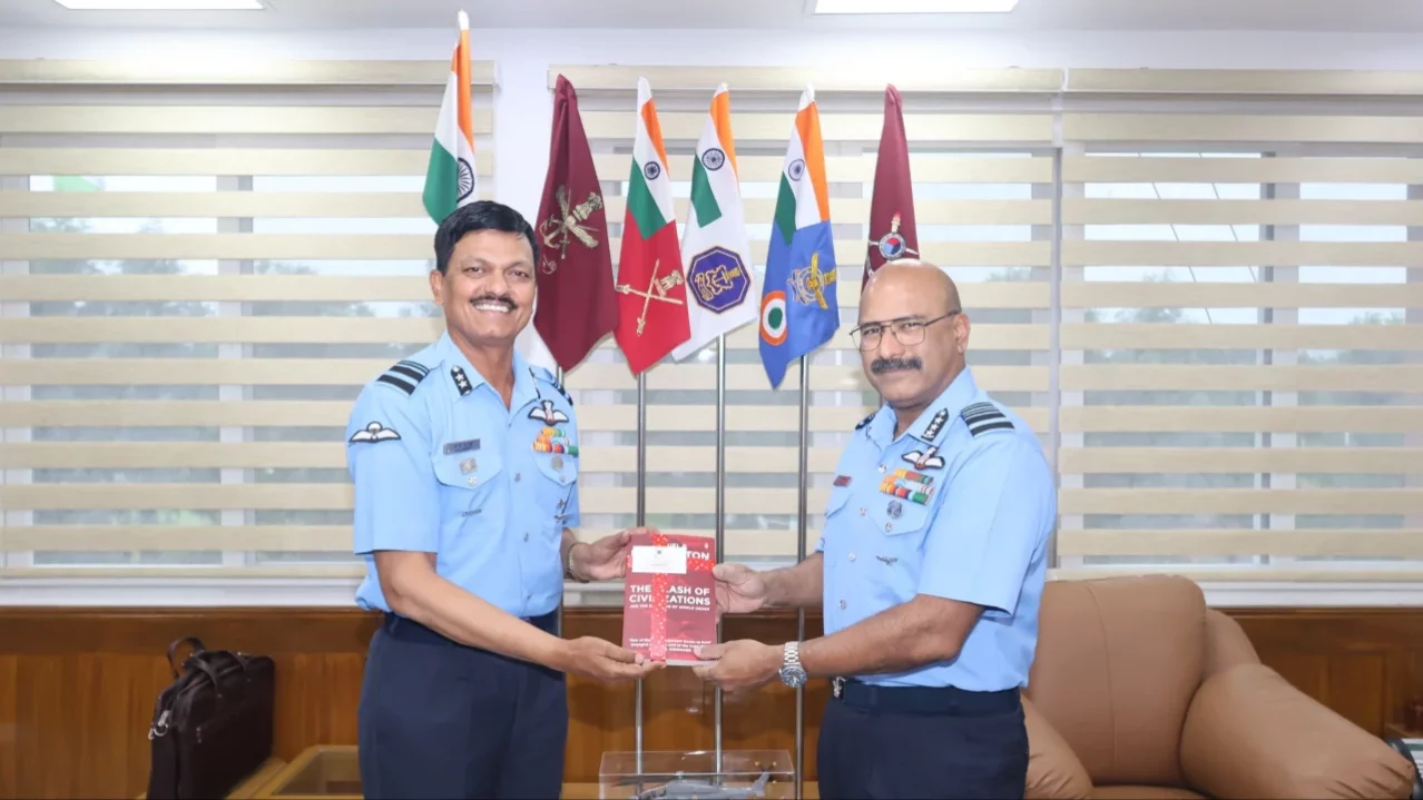 Air Marshal George Thomas Giving a Book