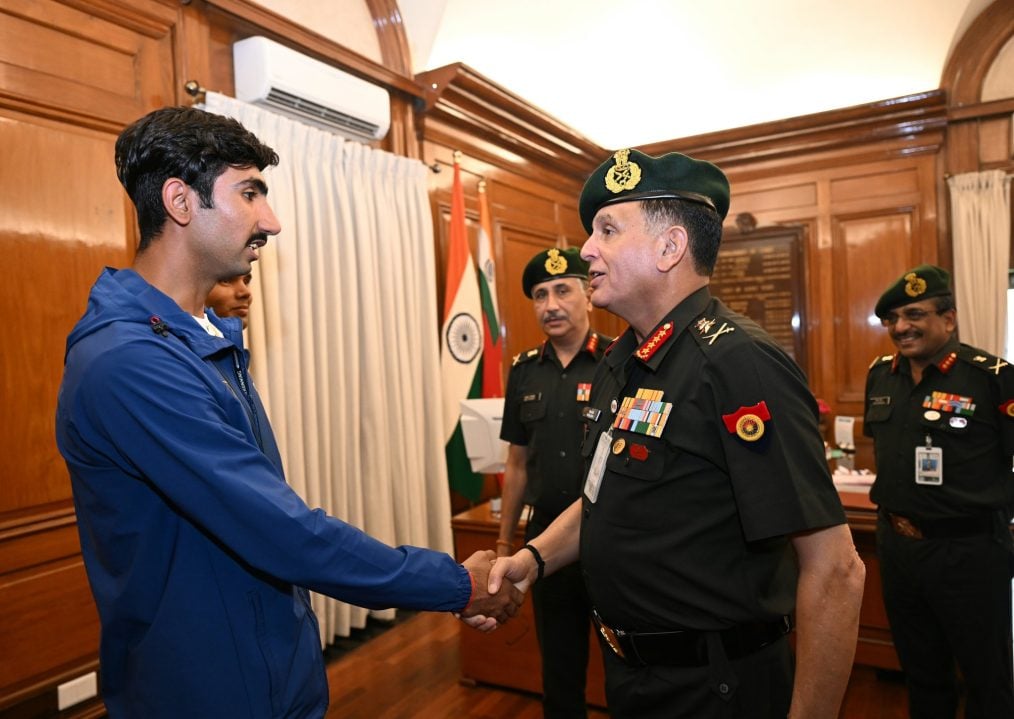 General Dhiraj Seth Shaking Hands