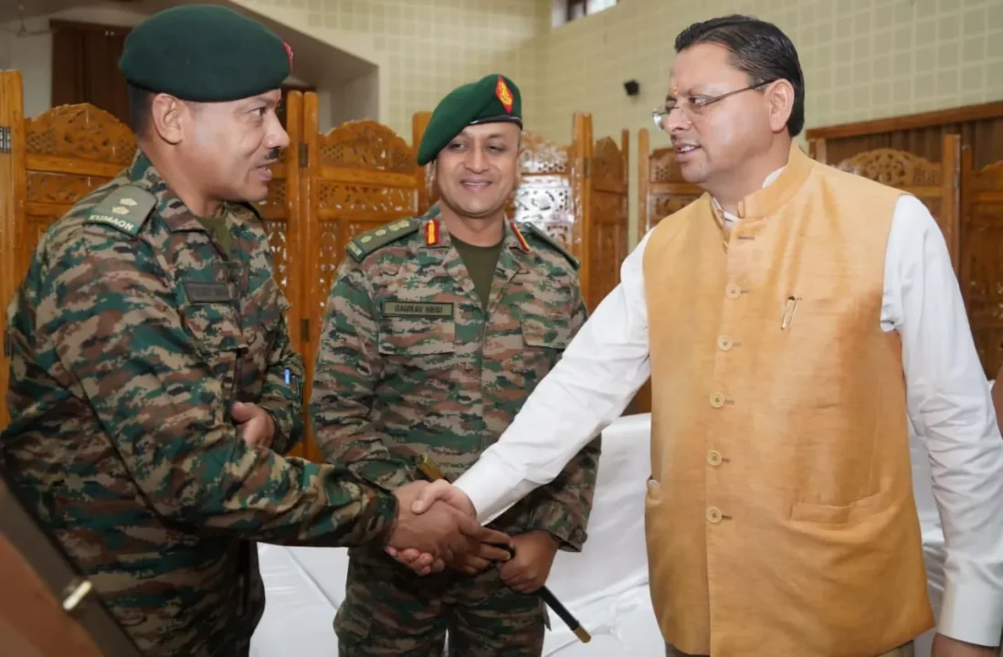 CM Dhami Shaking Hands